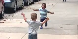 Stillshot of video showing toddlers embracing