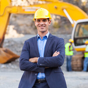 cheerful manager with arms crossed